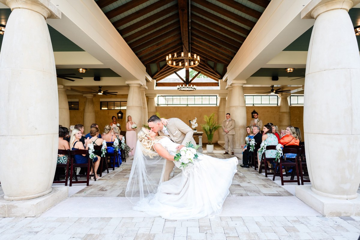 Dip kiss in the pavilion at 21 Main Events, North Myrtle Beach wedding photography