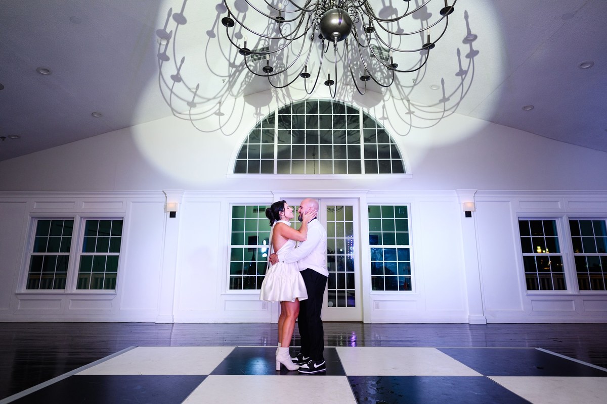 Couple under the chandelier at The Village House at Litchfield, Pawleys Island wedding photography