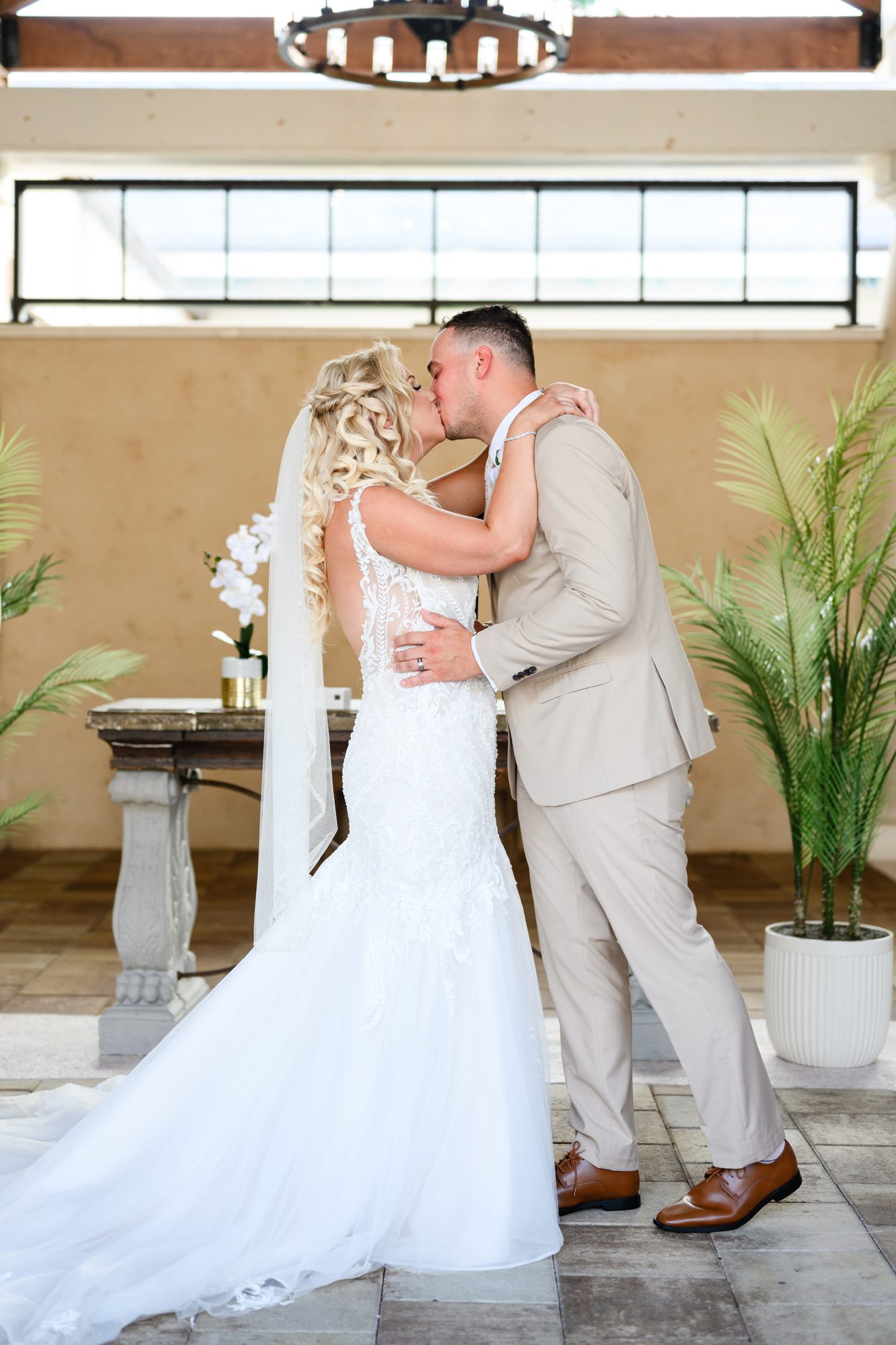 Olivia and Robert sharing their first kiss at the ceremony at 21 Main Events