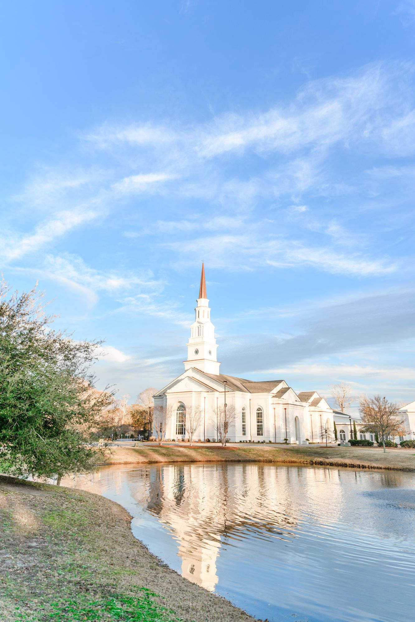 White steeple church beside a pond — a coastal South Carolina wedding venue