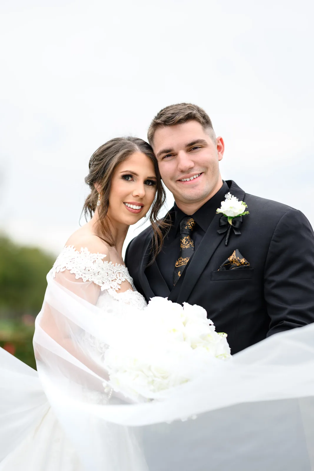 Close portrait of Kayla and Austin smiling at Pine Lakes Country Club