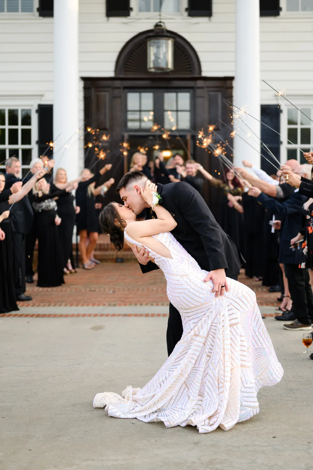 Kayla and Austin kissing during their grand exit at the Pine Lakes clubhouse doors