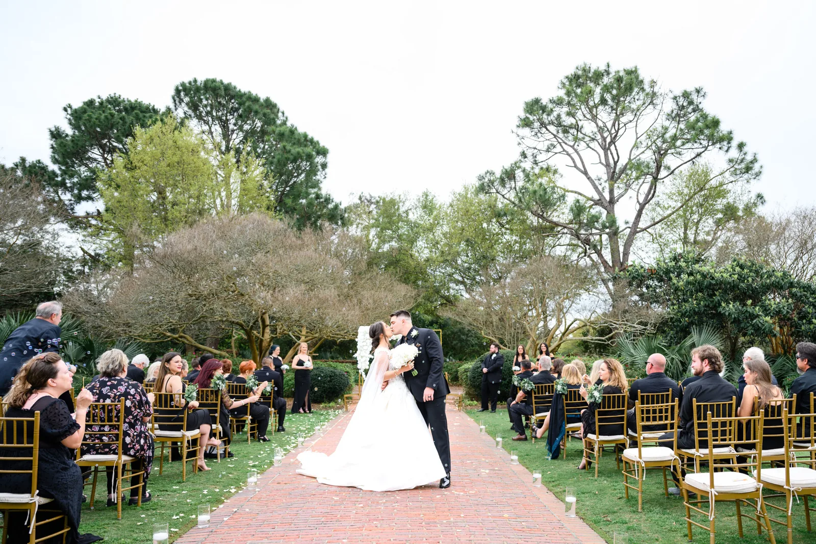 Kayla and Austin's outdoor ceremony on the Pine Lakes lawn under the oaks
