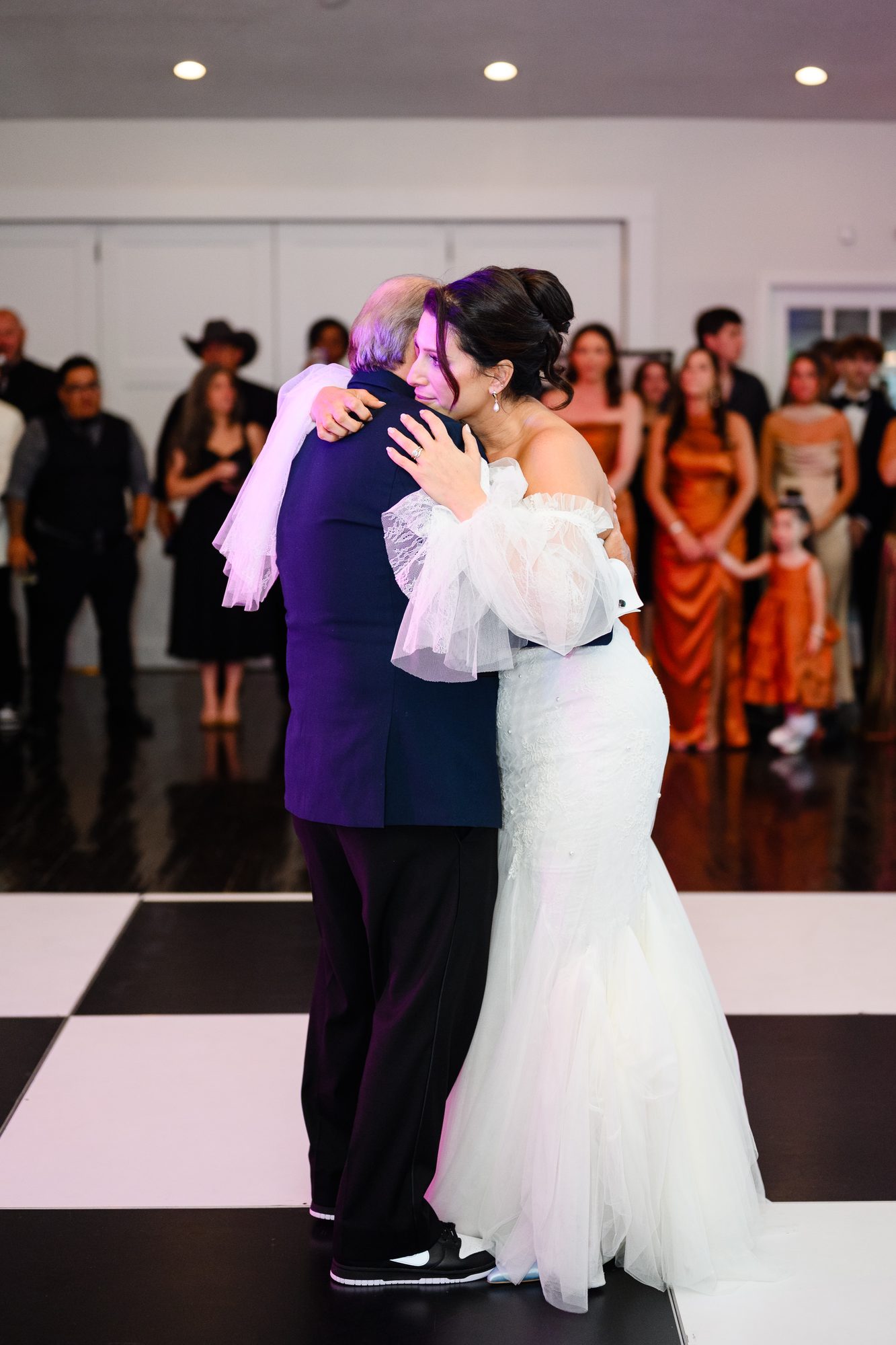 Shannon dancing with a guest on the checkered dance floor at The Village House
