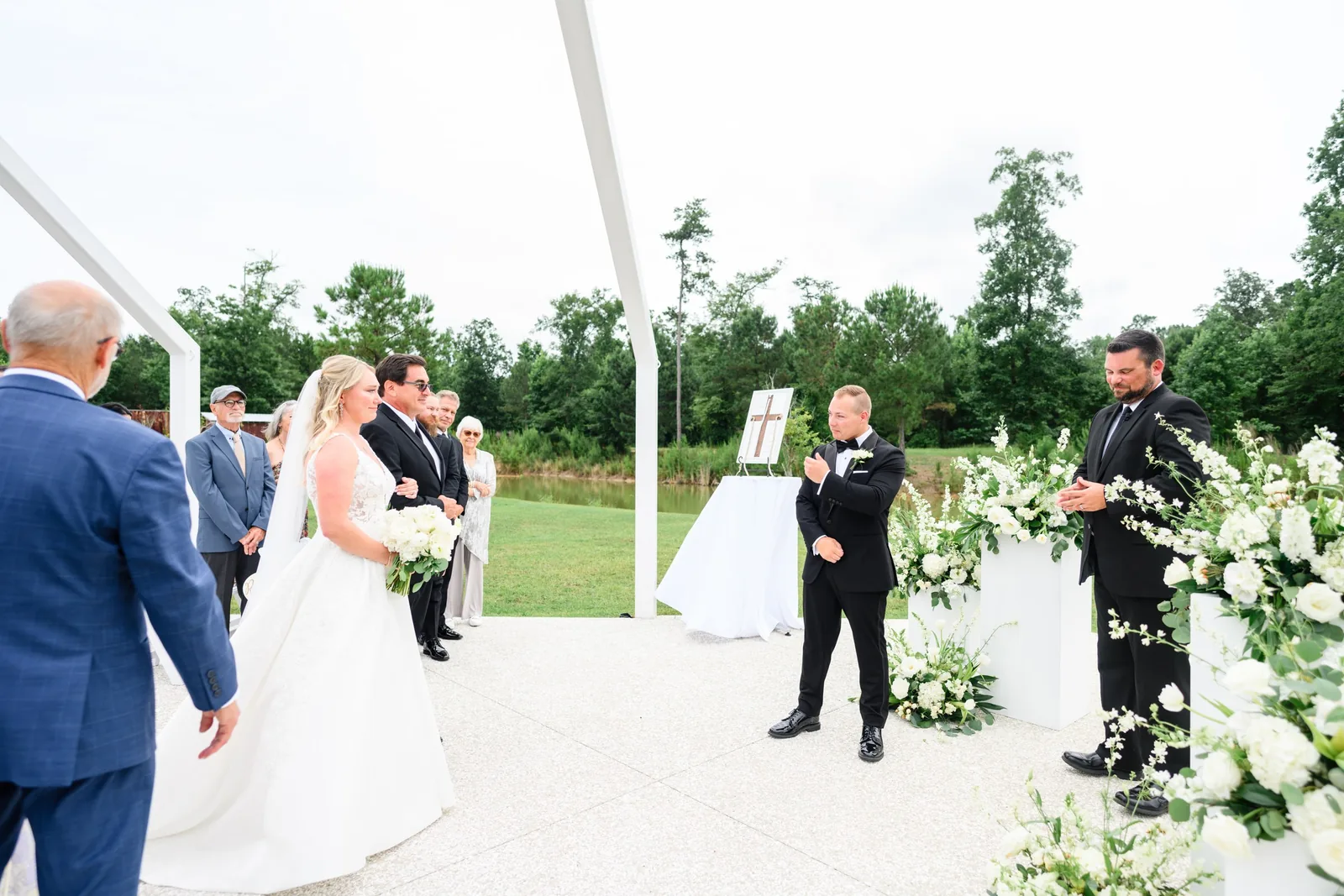 Alexa and Carter exchange vows at the outdoor ceremony at White Oaks Farm in Longs, SC