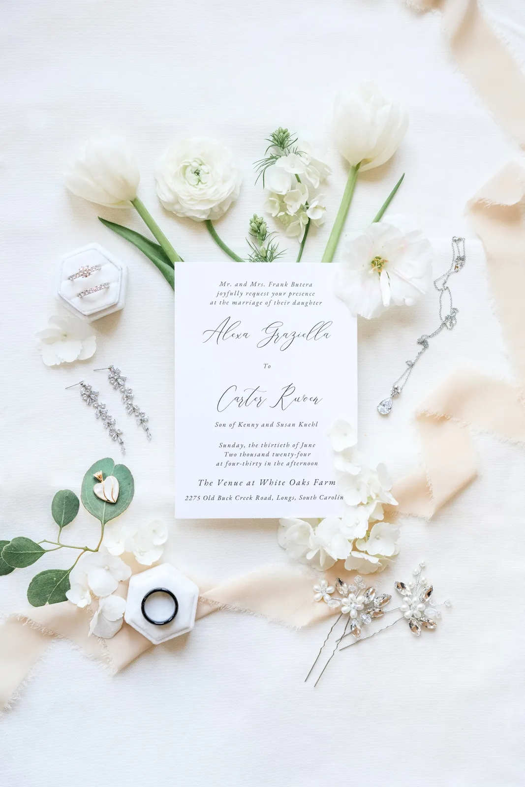 Alexa and Carter's wedding invitation with white tulips and ranunculus for their White Oaks Farm wedding